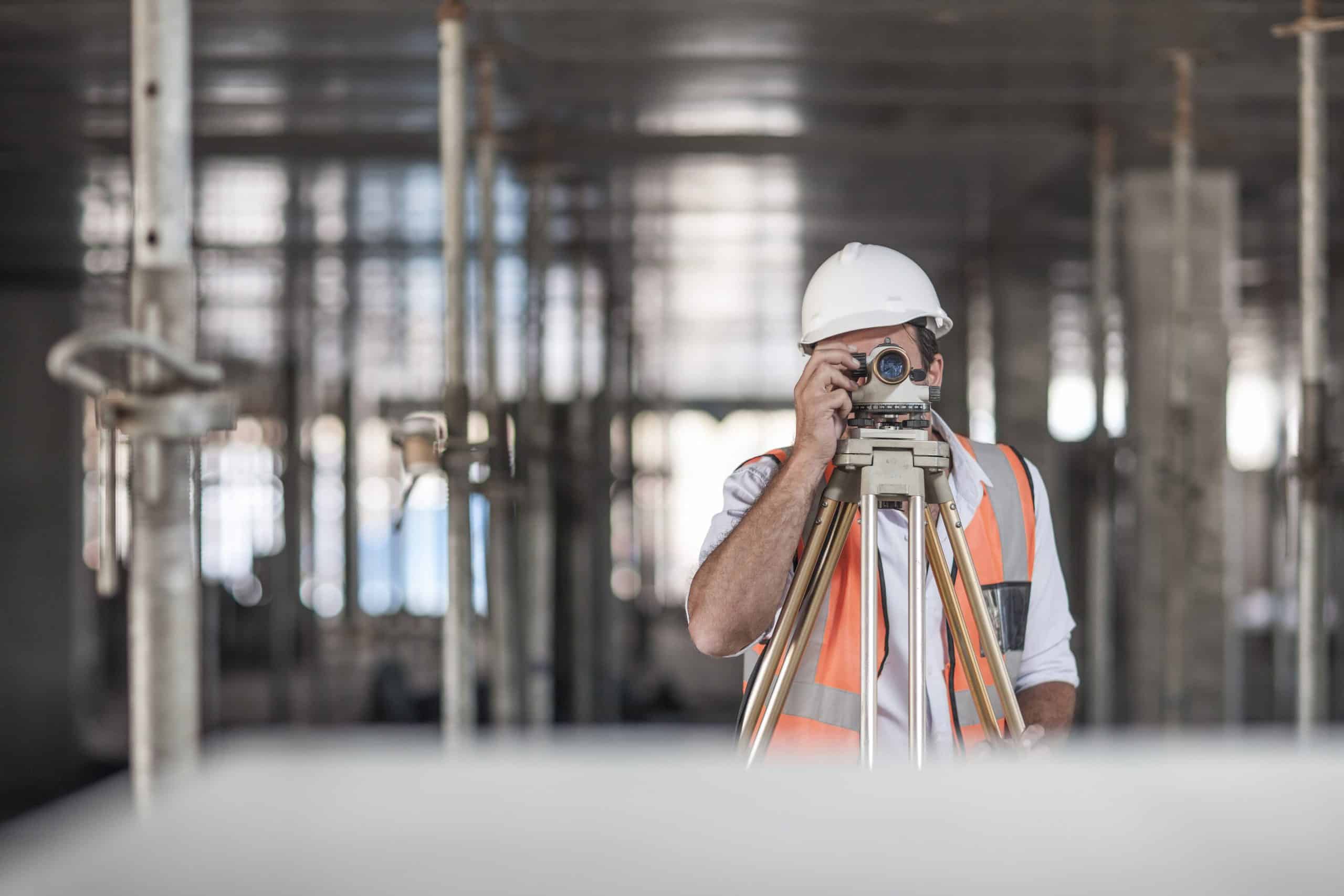 a man in a hard hat using a camera